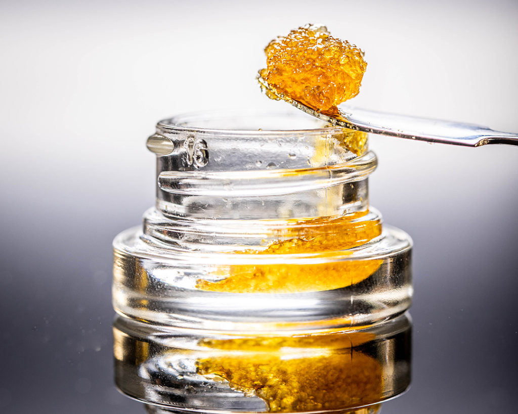 Live Resin Dab Sauce Cannabis Oil Macro with Jar Isolated Legal California Extracts from Weed Dispensary