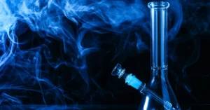 glass bong straight tube with smoke floating around