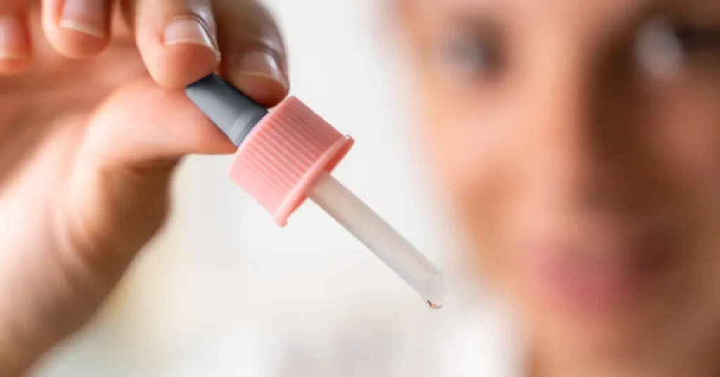Close-up of a cannabis tincture dropper with liquid oil, commonly used for precise THC or CBD dosing