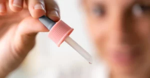 Close-up of a cannabis tincture dropper with liquid oil, commonly used for precise THC or CBD dosing