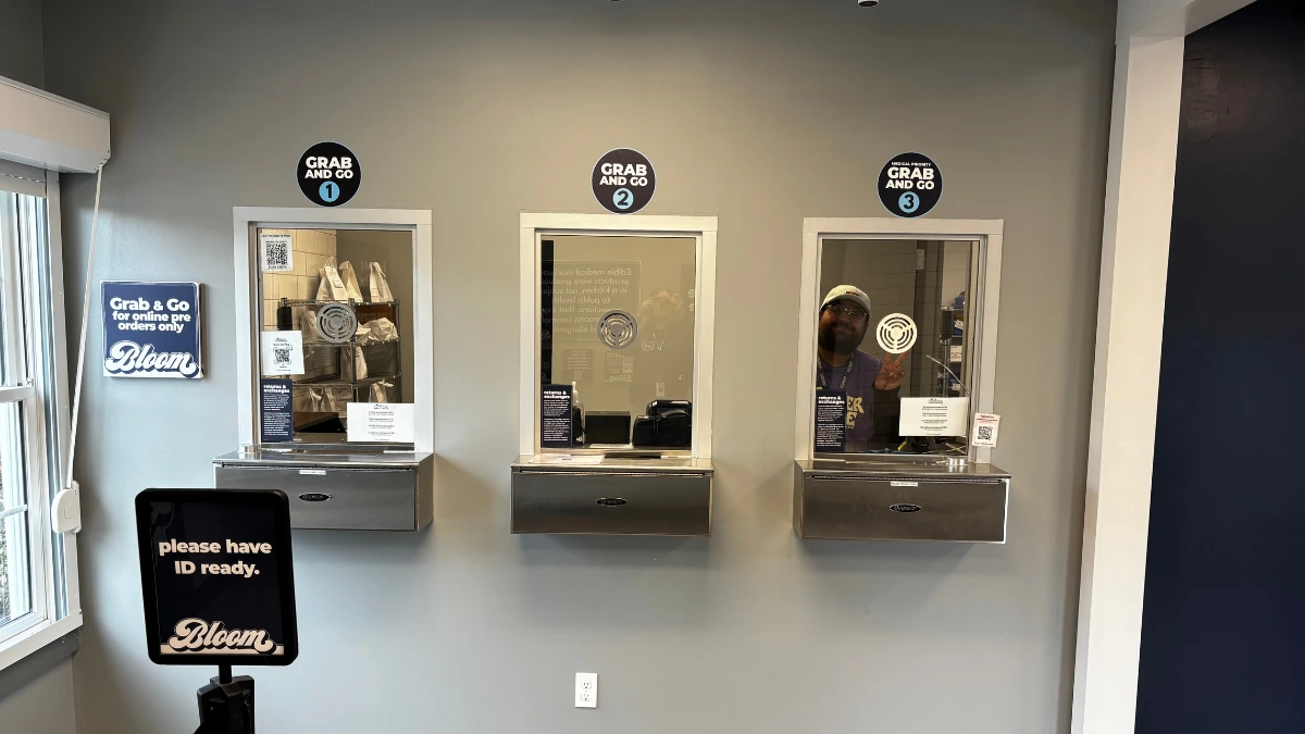 udtender at Bloom Painesville welcoming a first-time customer