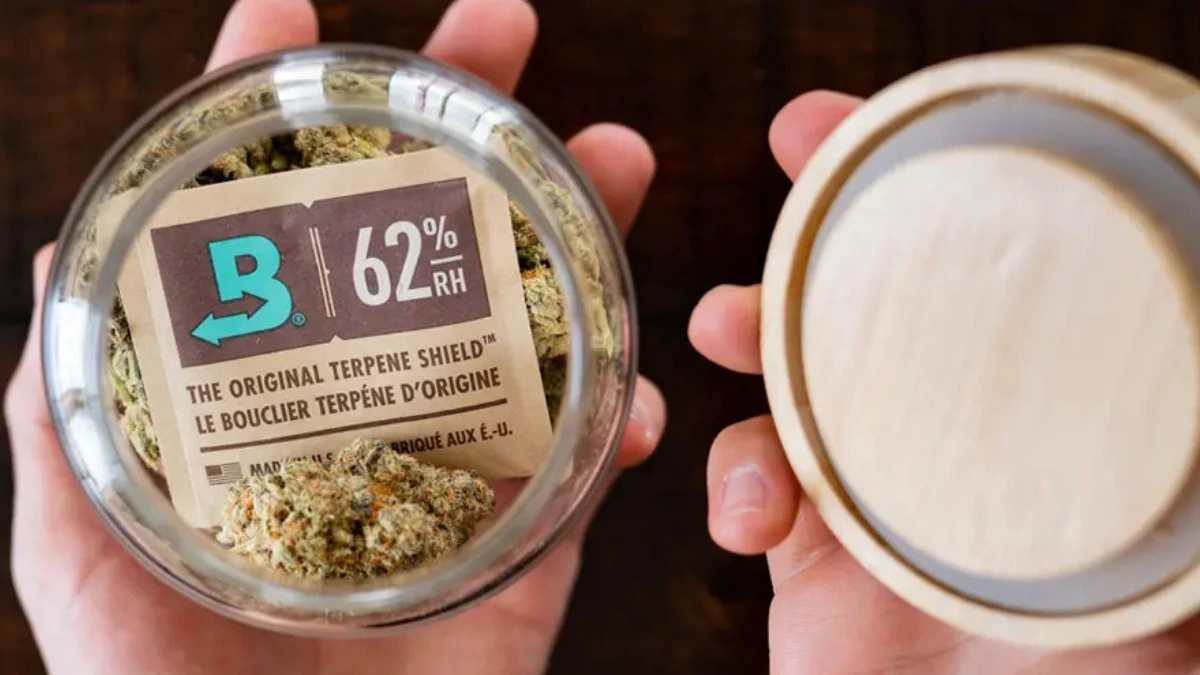 Two-way humidity pack inside a glass jar of cannabis flower